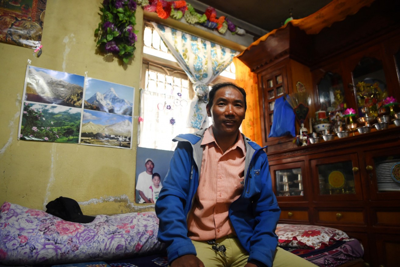 Kami Rita Sherpa sitting in his rented room on the outskirts of Kathmandu in March 2018 before his 22nd ascent. 