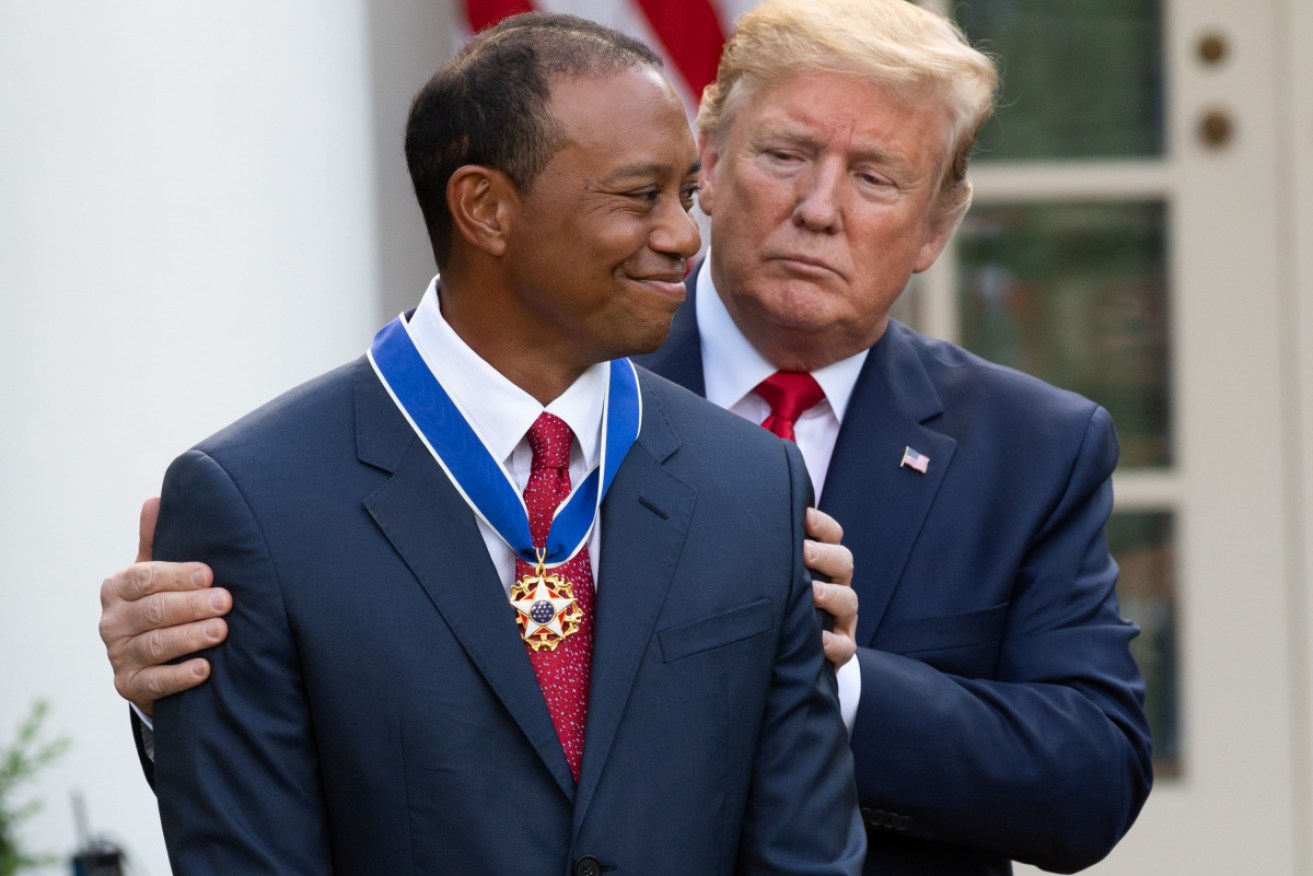 Tiger Woods doesn't need Donald Trump or anyone else to hold him up since he had spinal fusion surgery.