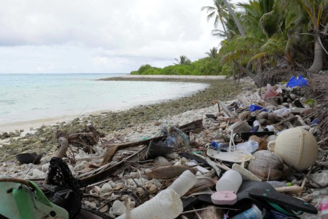 Around the corner from Direction Island's pristine tourist beaches is a sign of the global plastic pollution crisis.