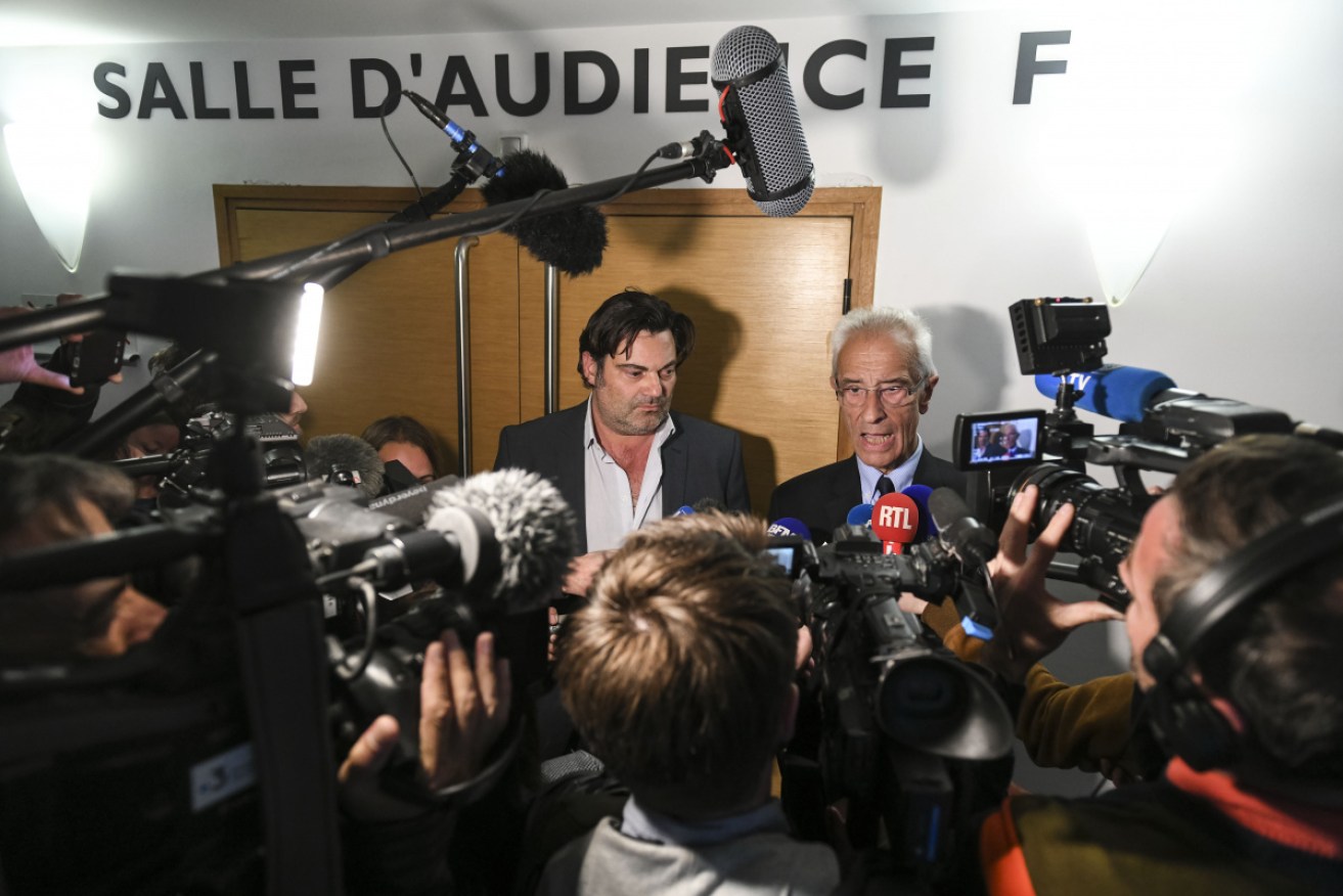 Frederic Pechier's lawyers Jean-Yves Le Borgne (right) and Randall Schwerdorffer address the media.