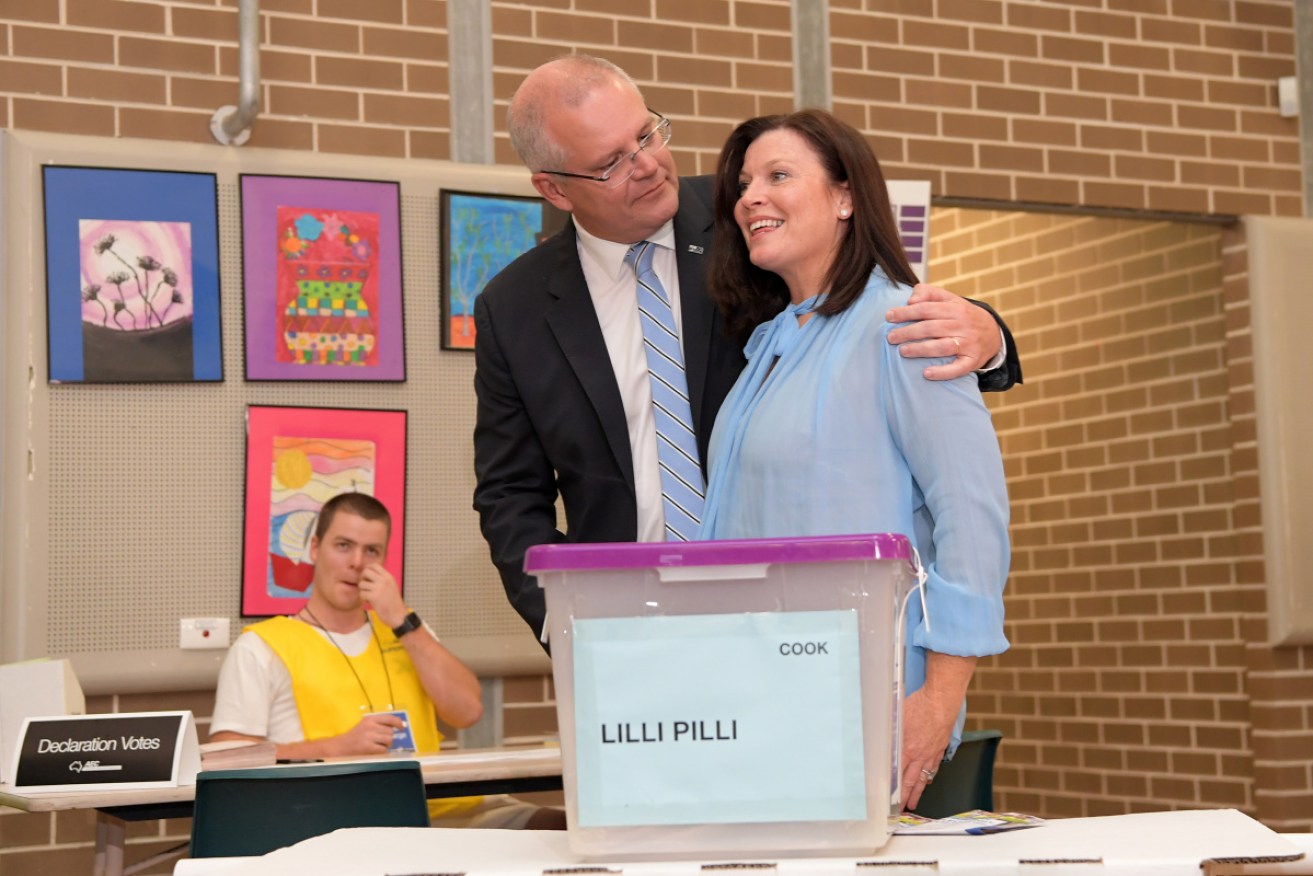 Scott Morrison, with his wife Jenny, casts his vote at Lilli Pilli Public School in Cronulla.