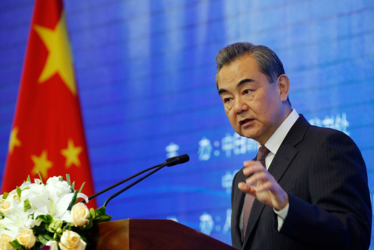 China's senior diplomat Wang Yi is calling on the USA to act with caution amid trade and business tensions between the two powers. 