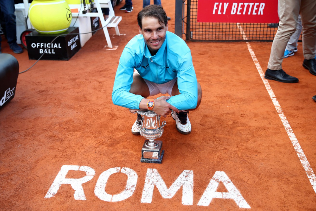 Rafael Nadal with his winners trophy after his three set victory against Novak Djokovic in the men's final.