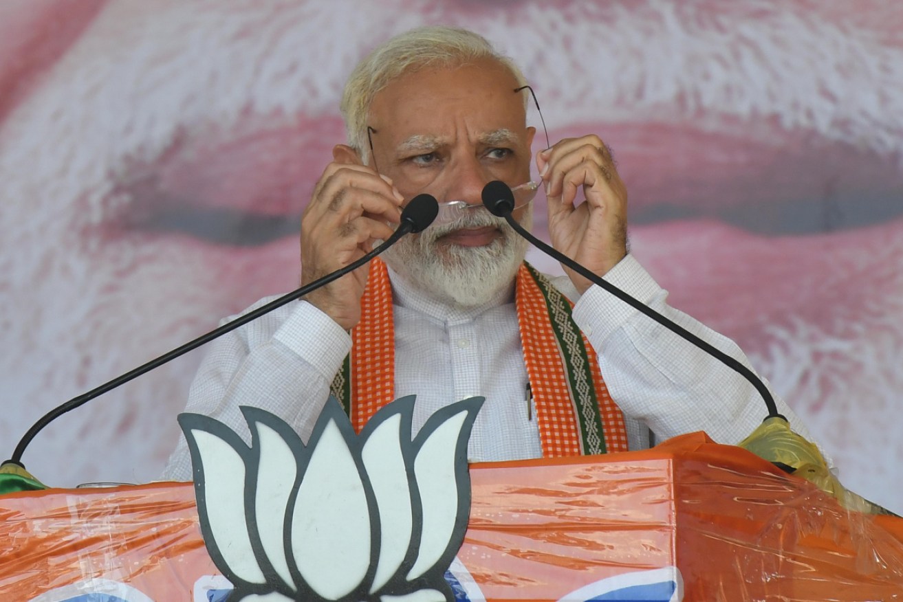 Prime Minister Narendra Modi addresses his supporters during an election campaign rally ahead of the national elections.