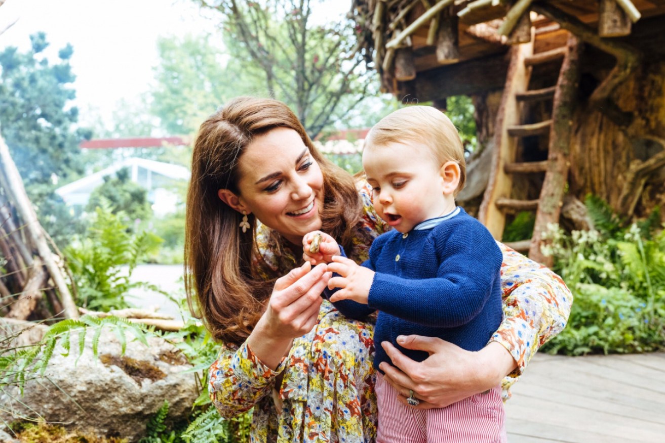 The Duchess of Cambridge and son Prince Louis in her Chelsea Flower Show garden.