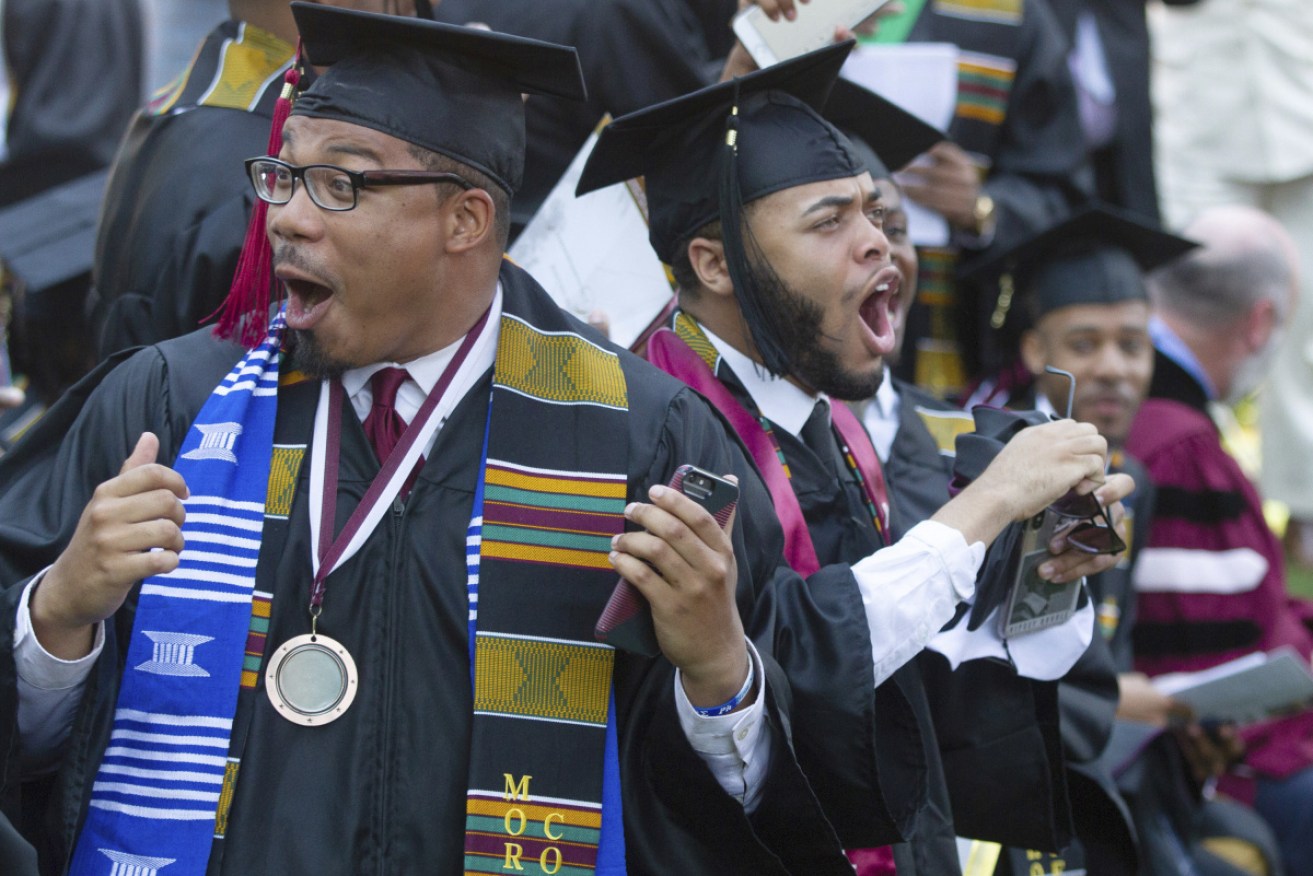 Morehouse College graduates react after hearing their students debts will be paid off for them.