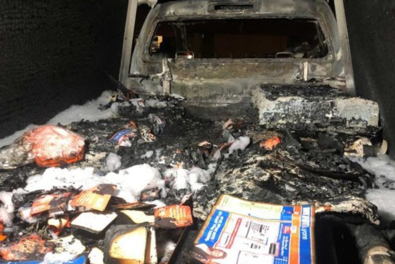 Burnt how-to-vote cards and election material in the back of a One Nation truck. 