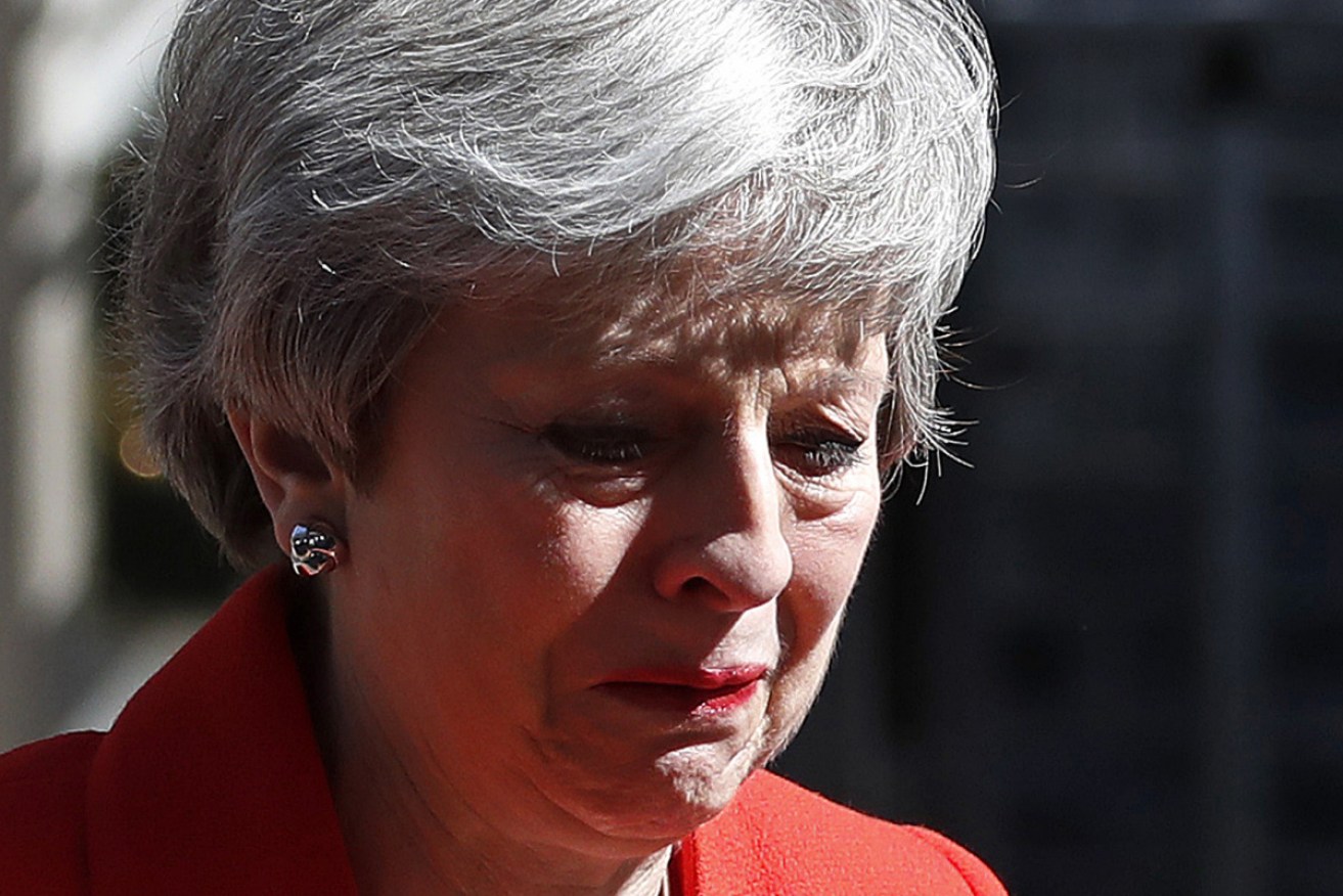 Ms May in a rare display of emotion as she turns to walk back into 10 Downing St. 