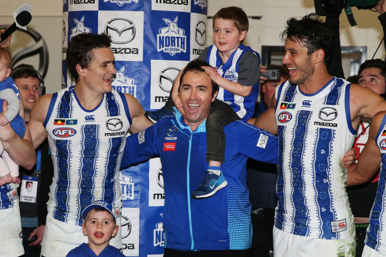 One last time: Brad Scott sings the club song with his son after the game. 