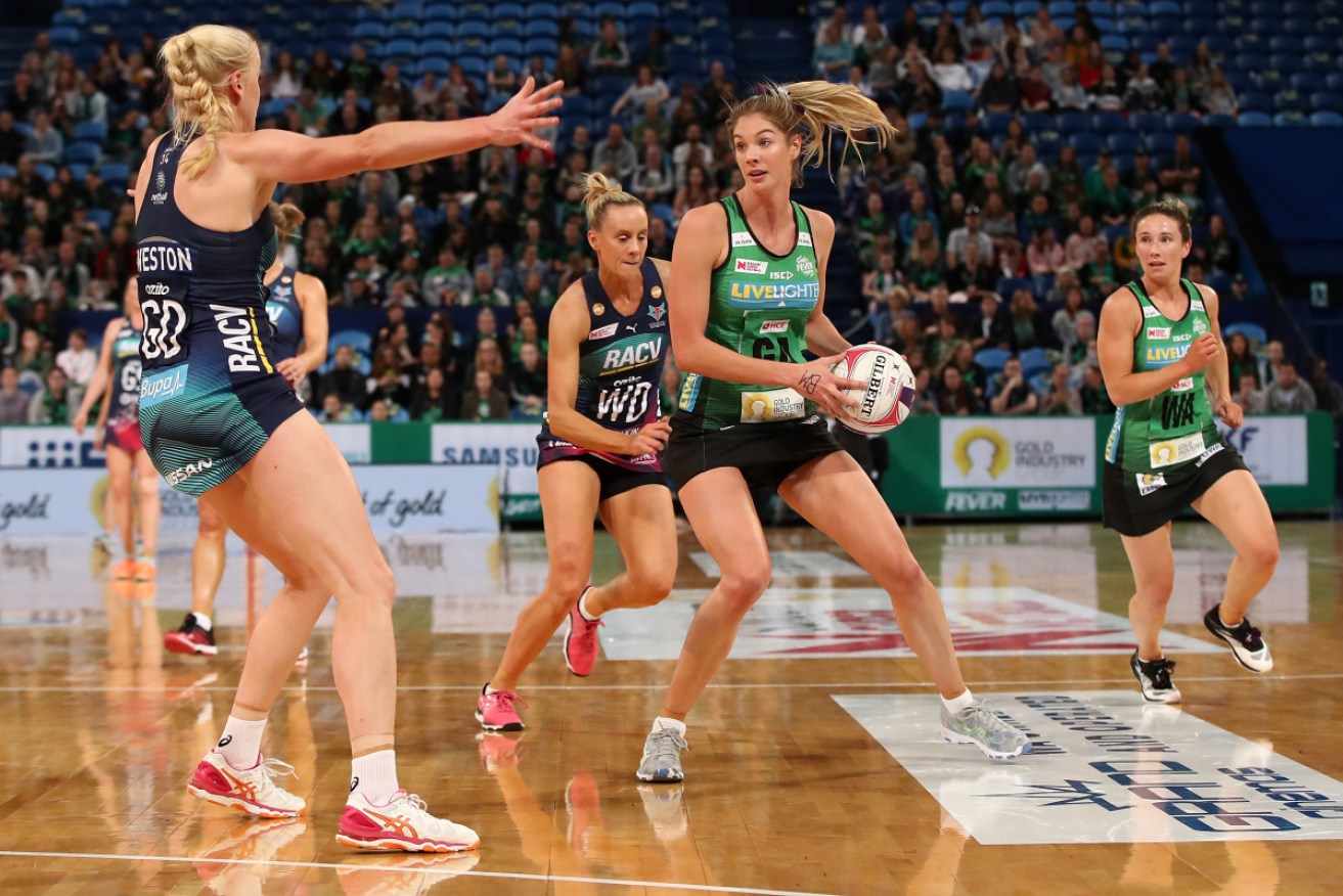 Kaylia Stanton of West Coast Fever looks to pass against the Vixens. 