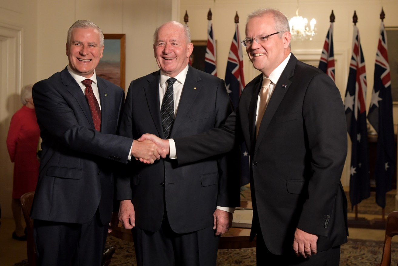 Nationals leader Michael McCormack (left) and Prime Minister Scott Morrison (right) are in good spirits at the Morrison government's swearing in on Wednesday. 