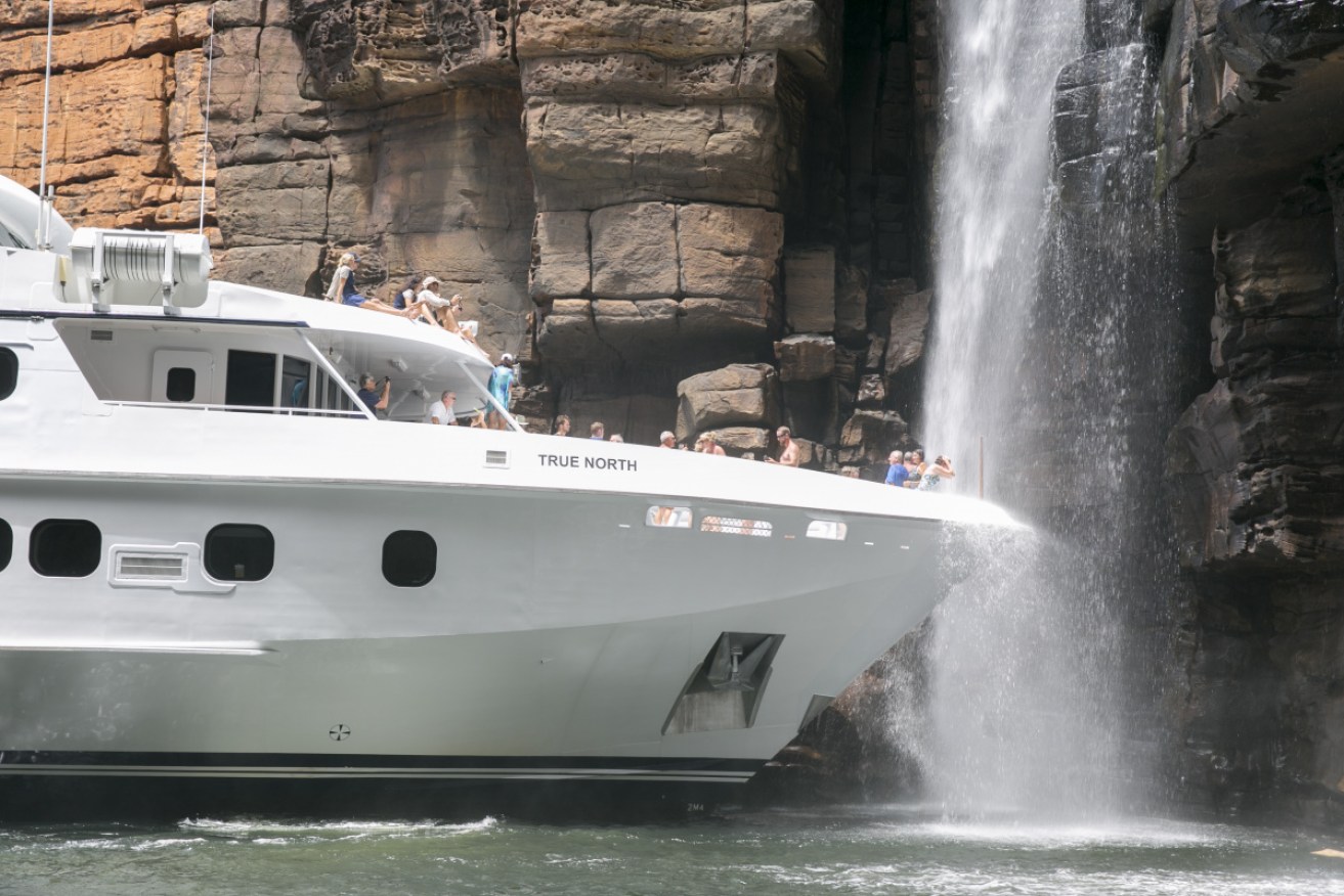 Up close and personal with a Kimberley waterfall – without leaving the ship.