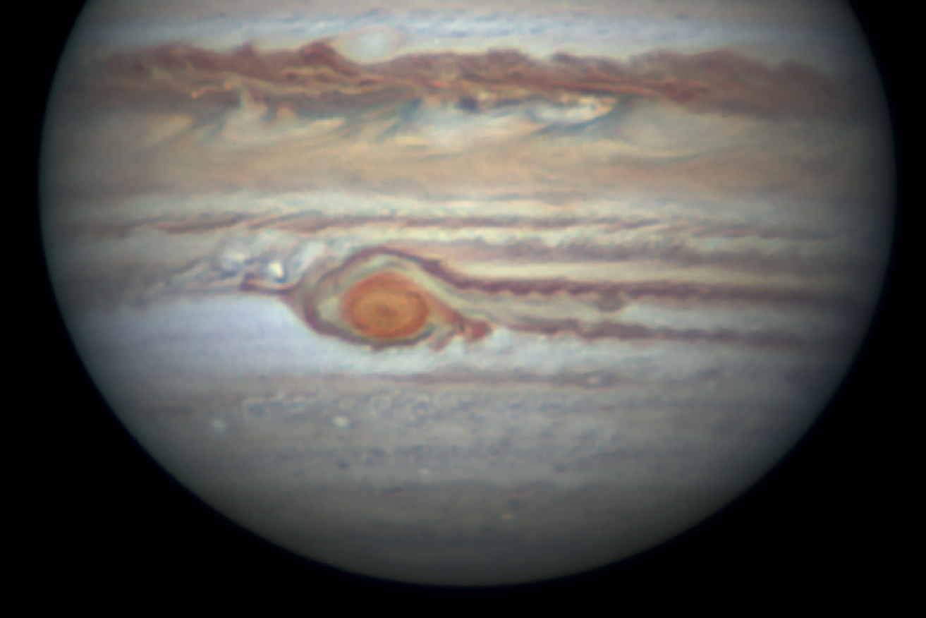 For about seven weeks, parts of Jupiter's Great Red Spot cyclone have been breaking off, under threat from other storms.