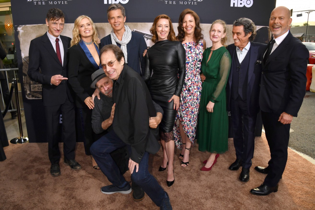 Together again: The cast of <i>Deadwood</i> at the premiere, with writer David Milch (front centre).