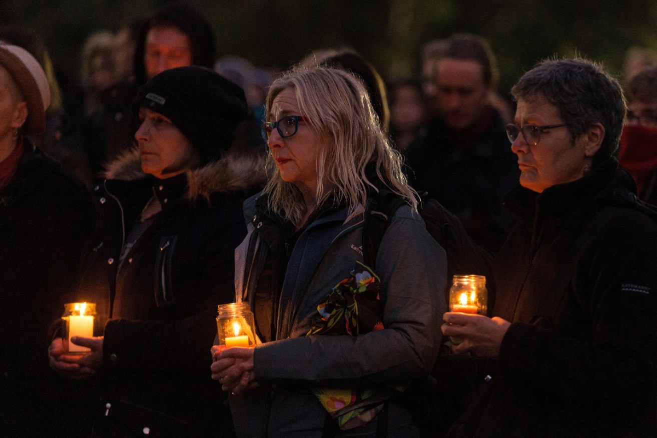 Mourners and people touched by the murder of Courtney Herron gather at a candlelight vigil in Melbourne. 