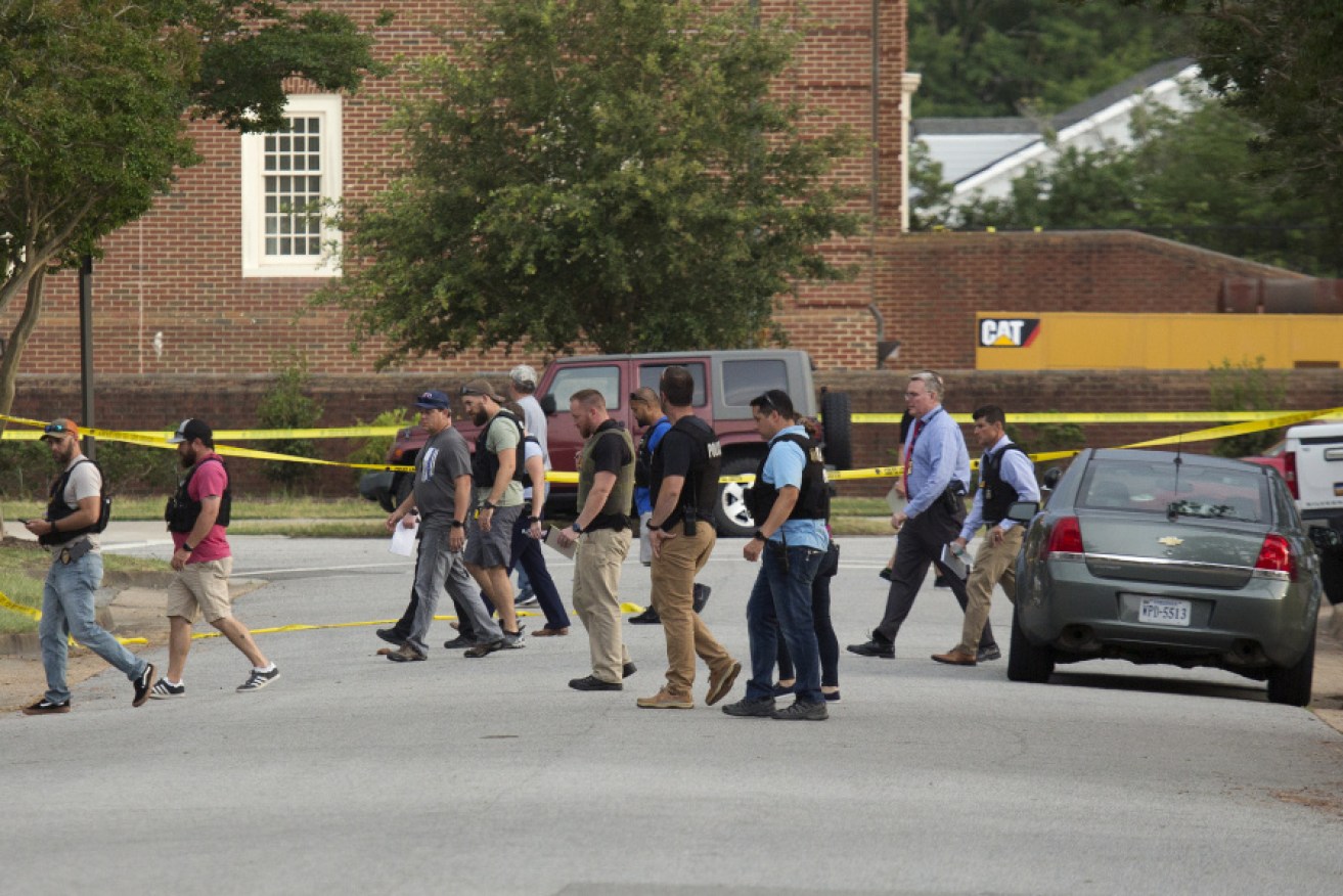 Dozens of investigators at the scene of America's 150th mass shooting this year.