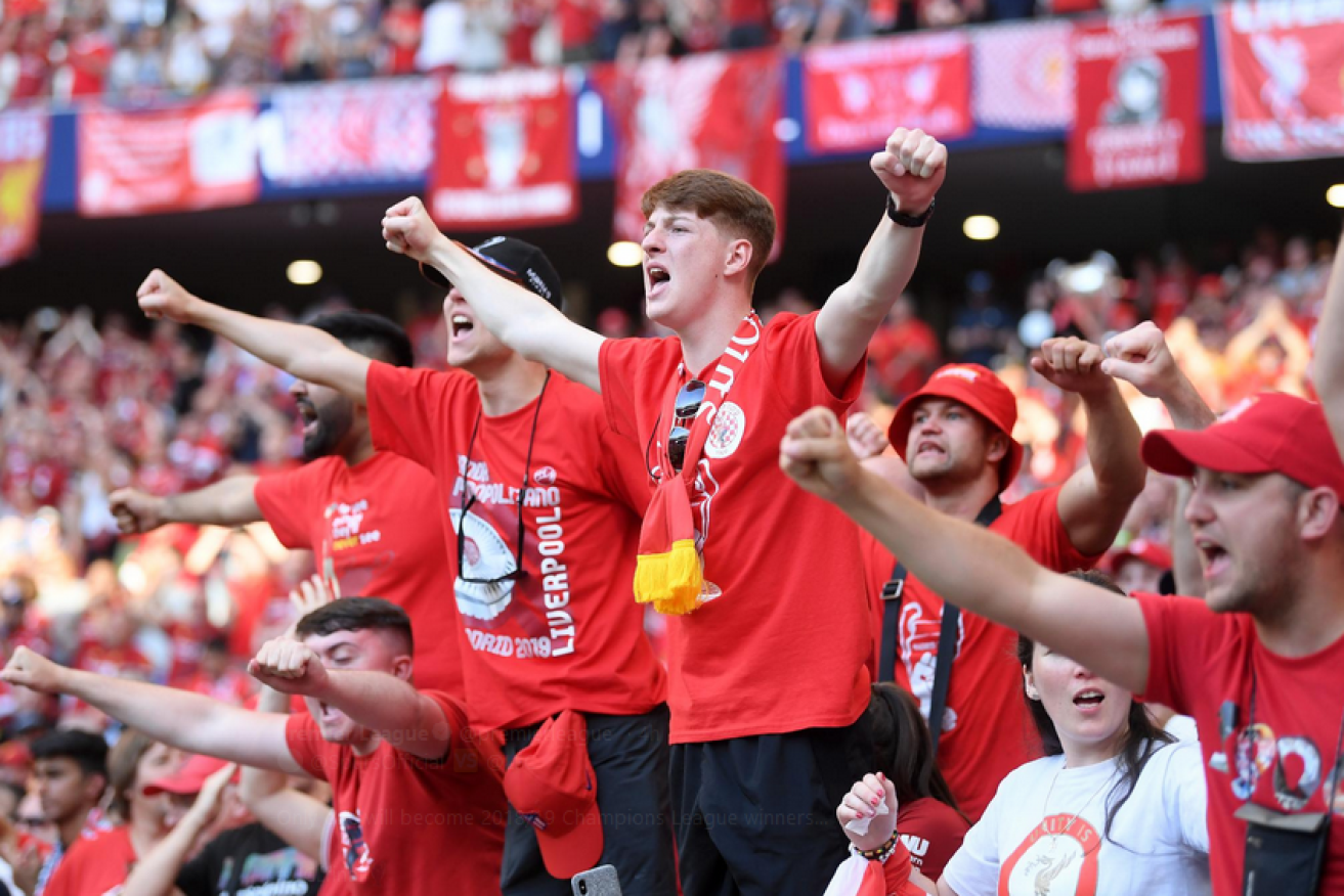 Liverpool fans swell with pride as their team surges to the EPL title.