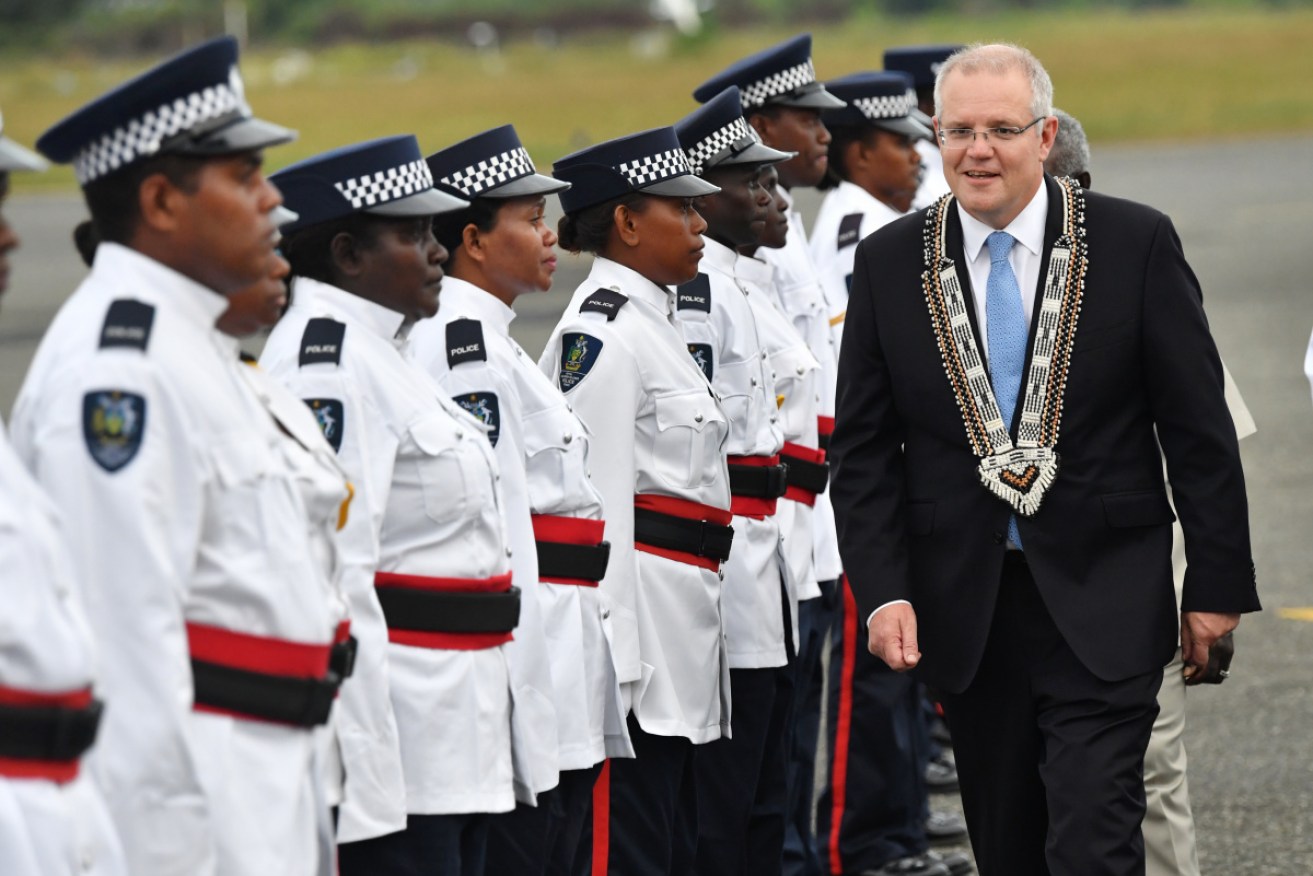 Australian Prime Minister Scott Morrison arrives at Honiara International Airport, in the Solomon Islands.