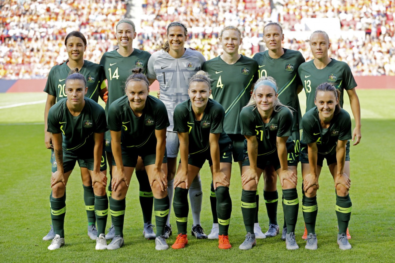 All smiles: The Matildas before their disappointing 3-0 loss to the Netherlands on the weeekend. 