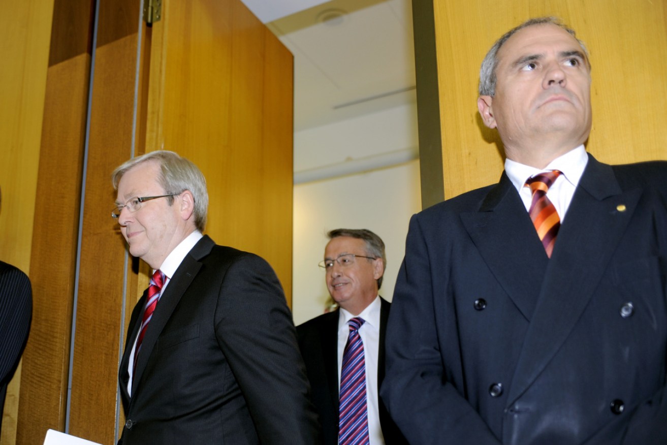 Former PM Kevin Rudd with Treasury secretary Dr Ken Henry (far right) splashed $12.7 billion in 2009. 