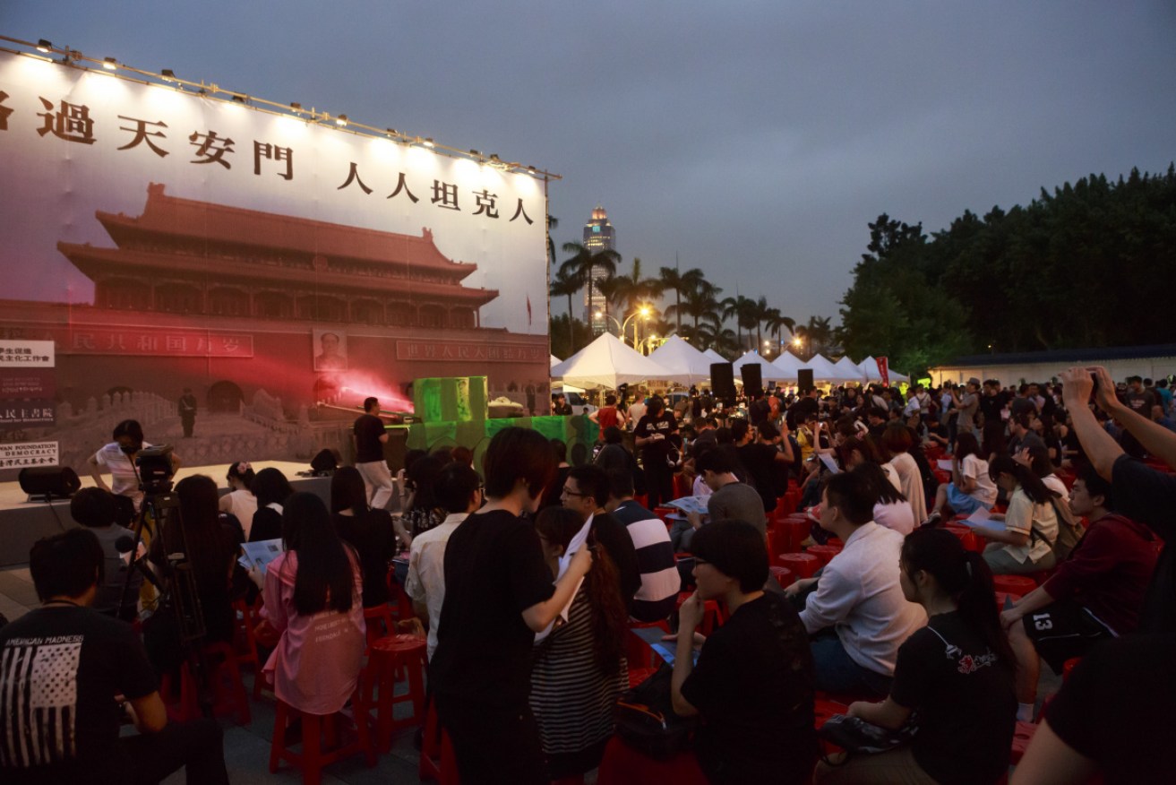 Taiwanese gather in Taipei's Freedom Square to mark the 25th anniversary of the Tiananmen Square massacre.
