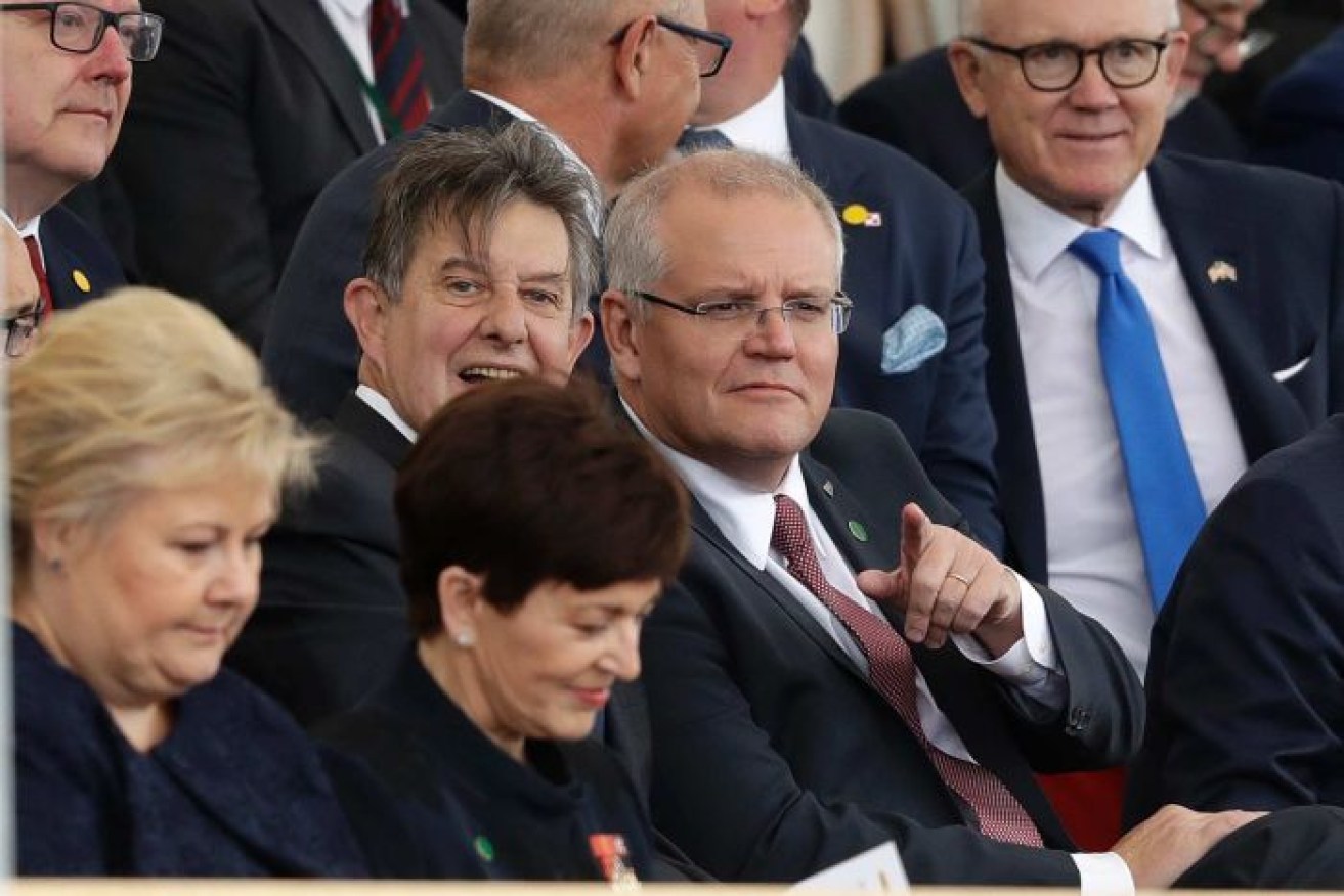Scott Morrison was questioned about AFP raids on the media after attending an event to mark the 75th anniversary of the D-Day landings.