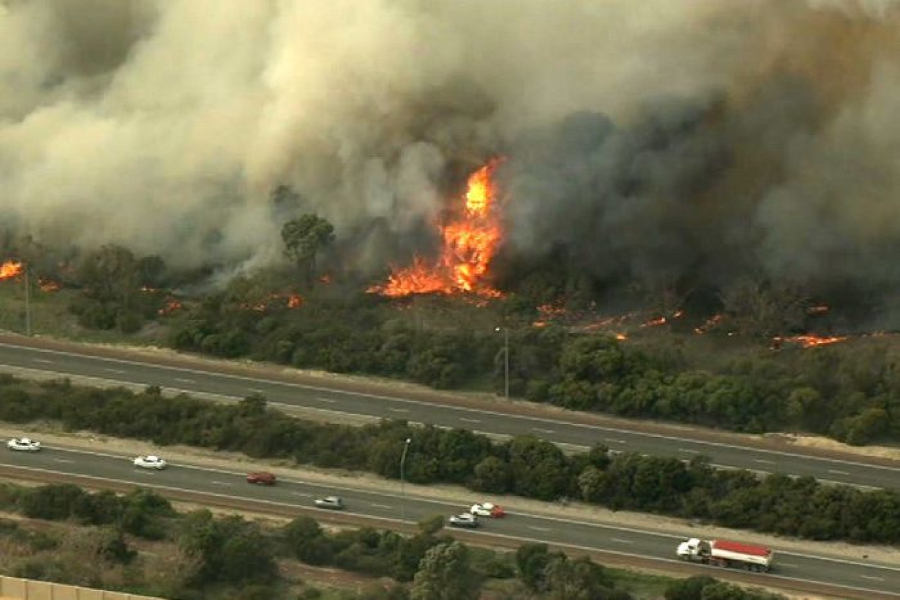 The fire has closed the freeway in both directions.