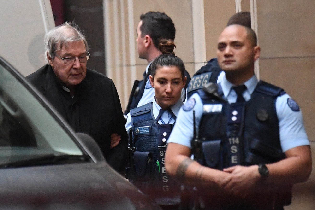 George Pell arrives at court for the second day of his appeal.