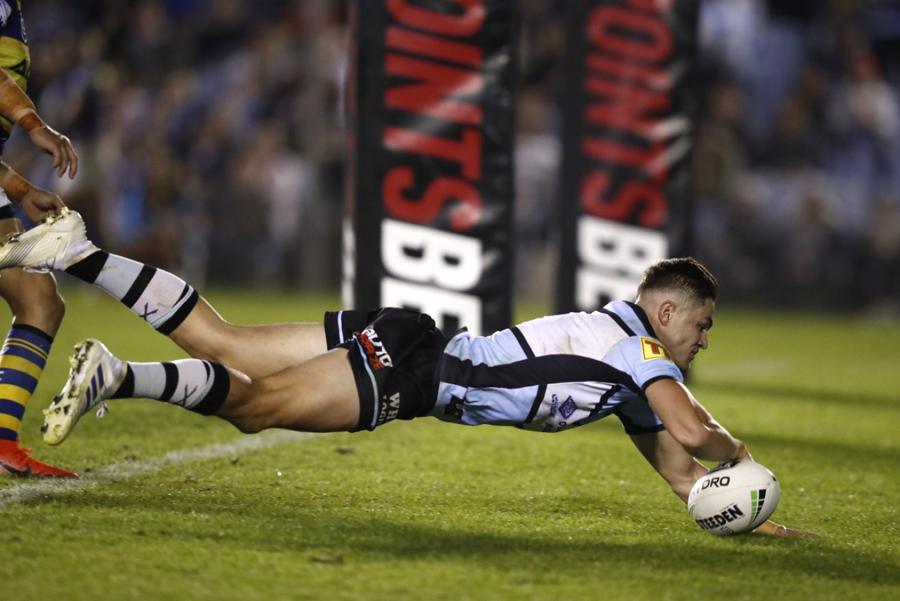 Cronulla's Kyle Flanagan scores in the match against the Eels. 