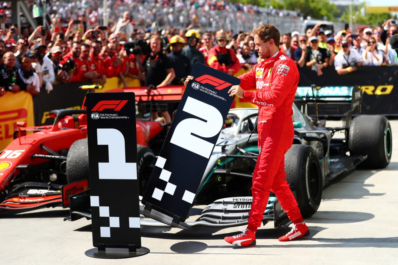 Sebastian Vettel switches the finishing boards in Parc Ferme after the Canadian Grand Prix. 
