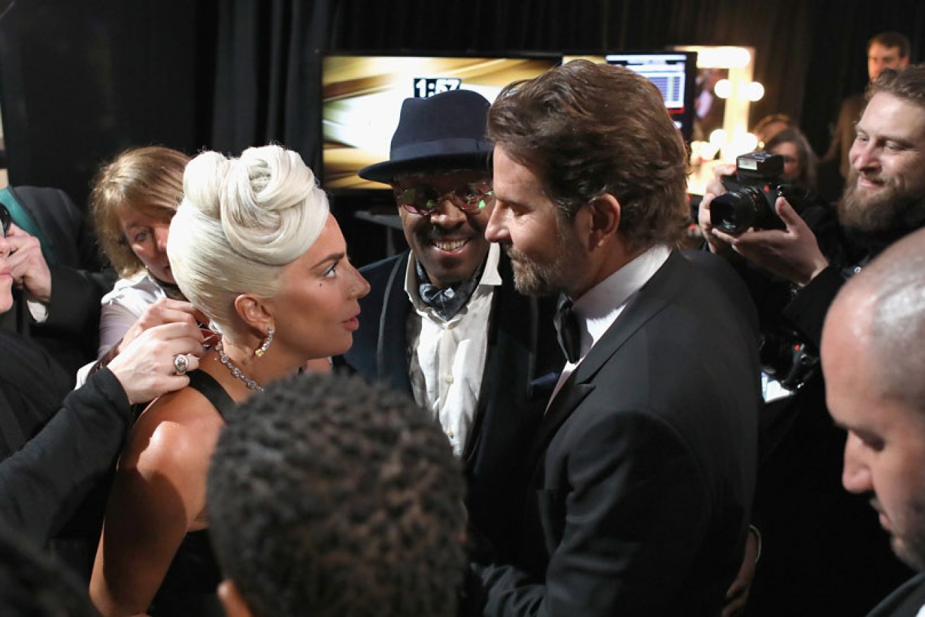 Lady Gaga and Bradley Cooper were the centre of attention backstage at February 29's Oscars.