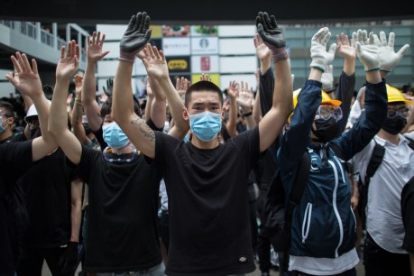 Hong Kong delays vote on extradition bill as protesters gather