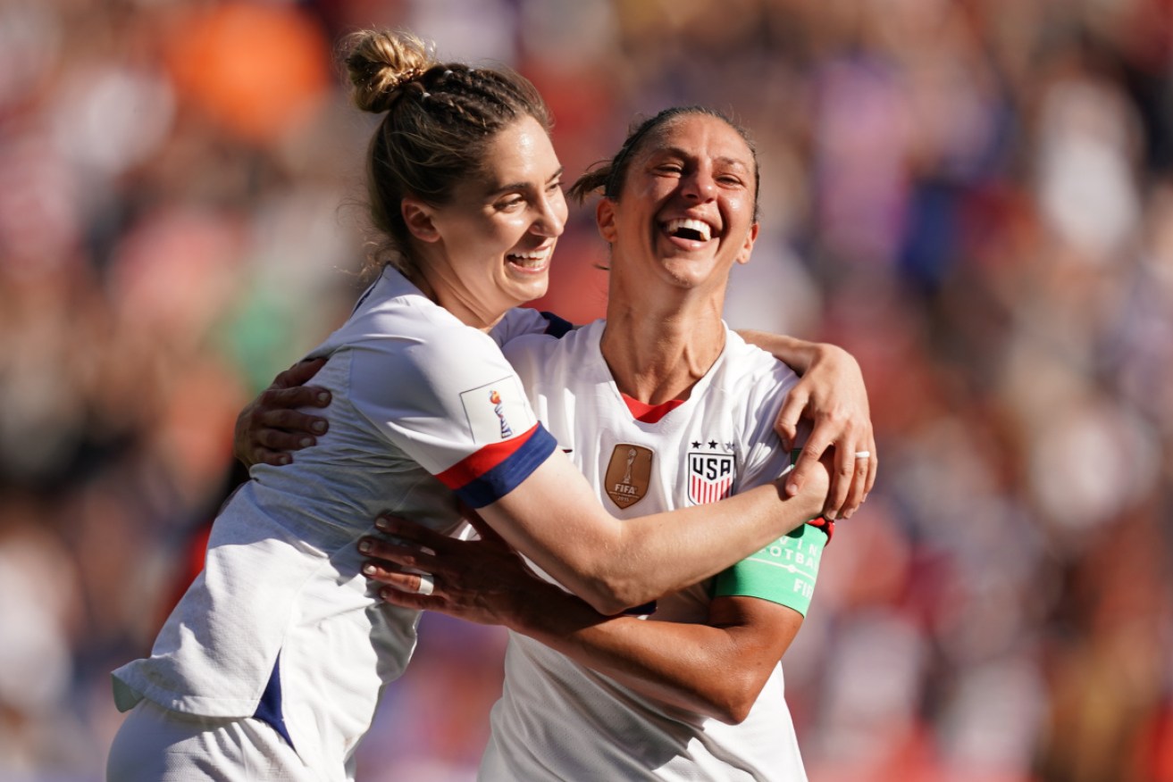 Morgan Brian and Carli Lloyd celebrate Lloyd's goal against Chile.