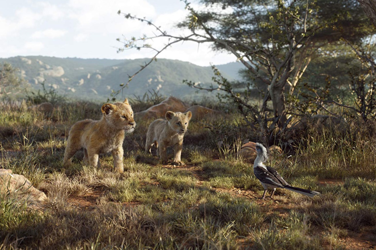 Lions Simba and Nala with hornbill bird Zazu in Disney's upcoming CGI reboot of <i>The Lion King.</i>