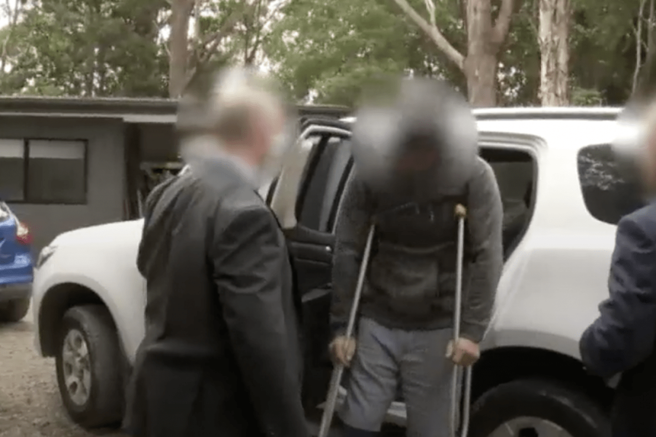 Detectives arrest Nathan Baggaley at his home in Byron Bay in NSW in 2019.
