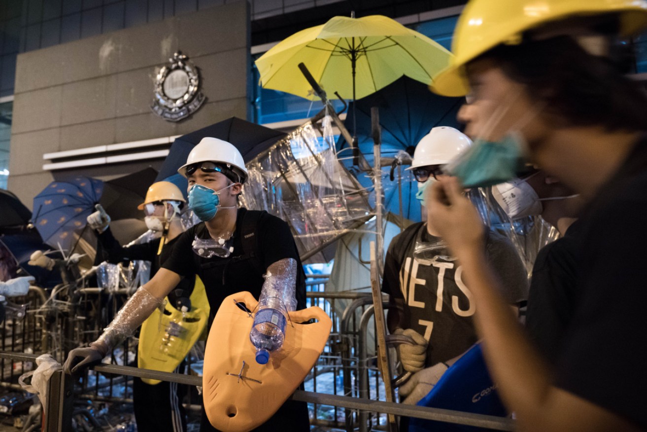 Thousands blockaded HK police headquarters overnight on Friday in protests now spanning two weeks.