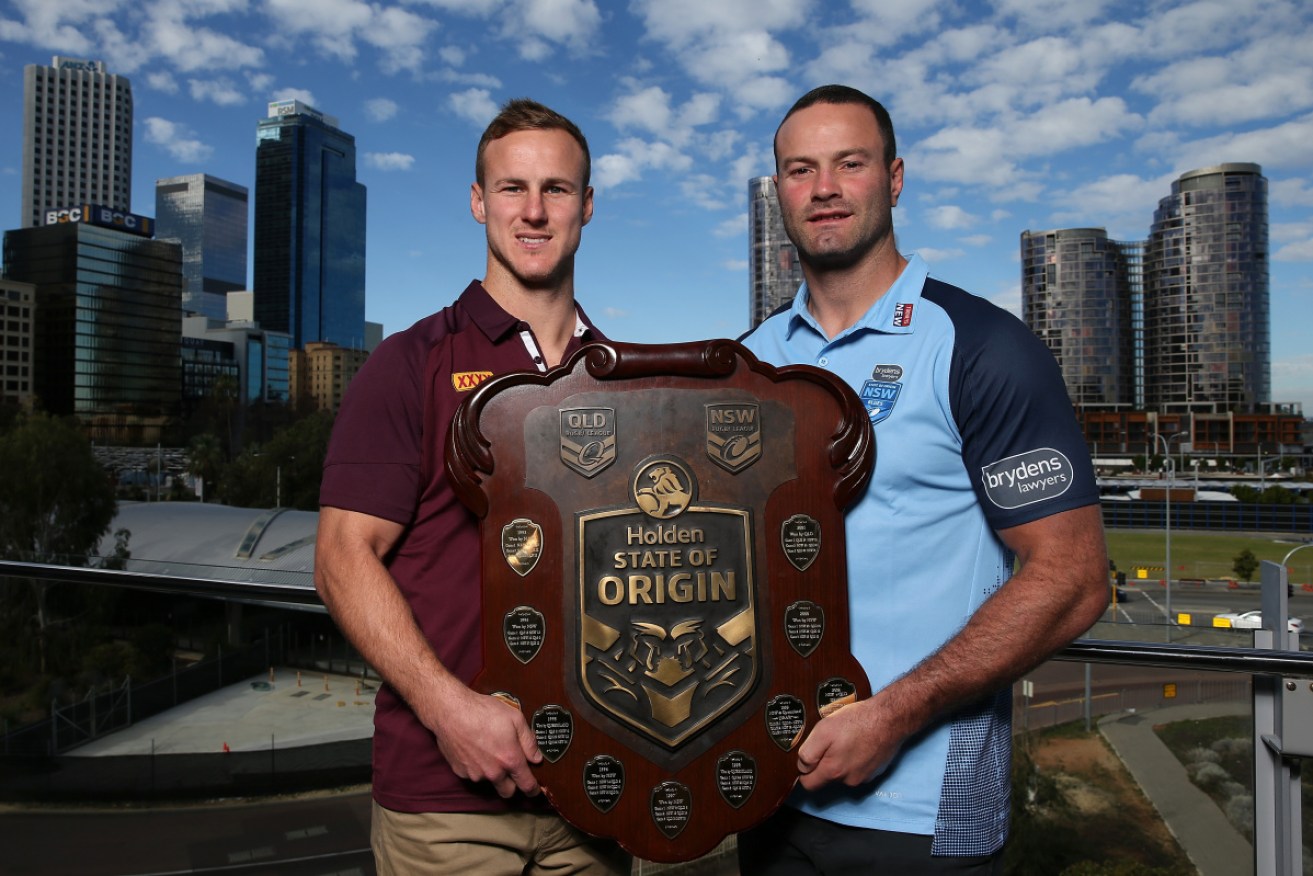Queensland's or a decider? Maroons' Daly Cherry-Evans (L) and NSW's Boyd Cordner with the State of Origin spoils. 