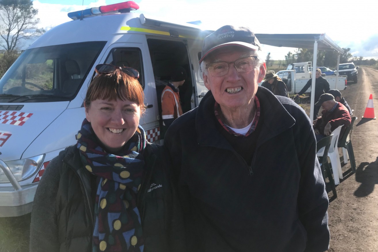 Sue Rondeau and volunteer Les Wise outside the van.
