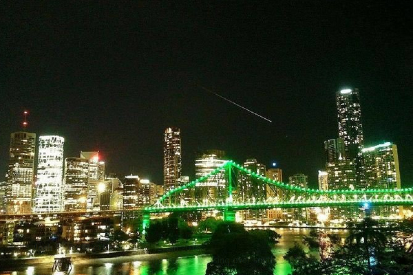 The meteor plunges earthward through Brisbane's night sky.