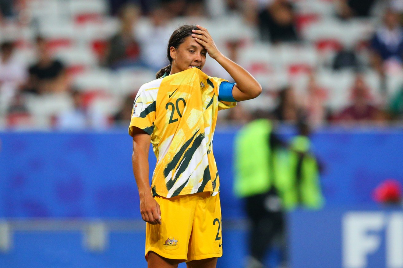 Sam Kerr takes a moment after missing her spot kick. 