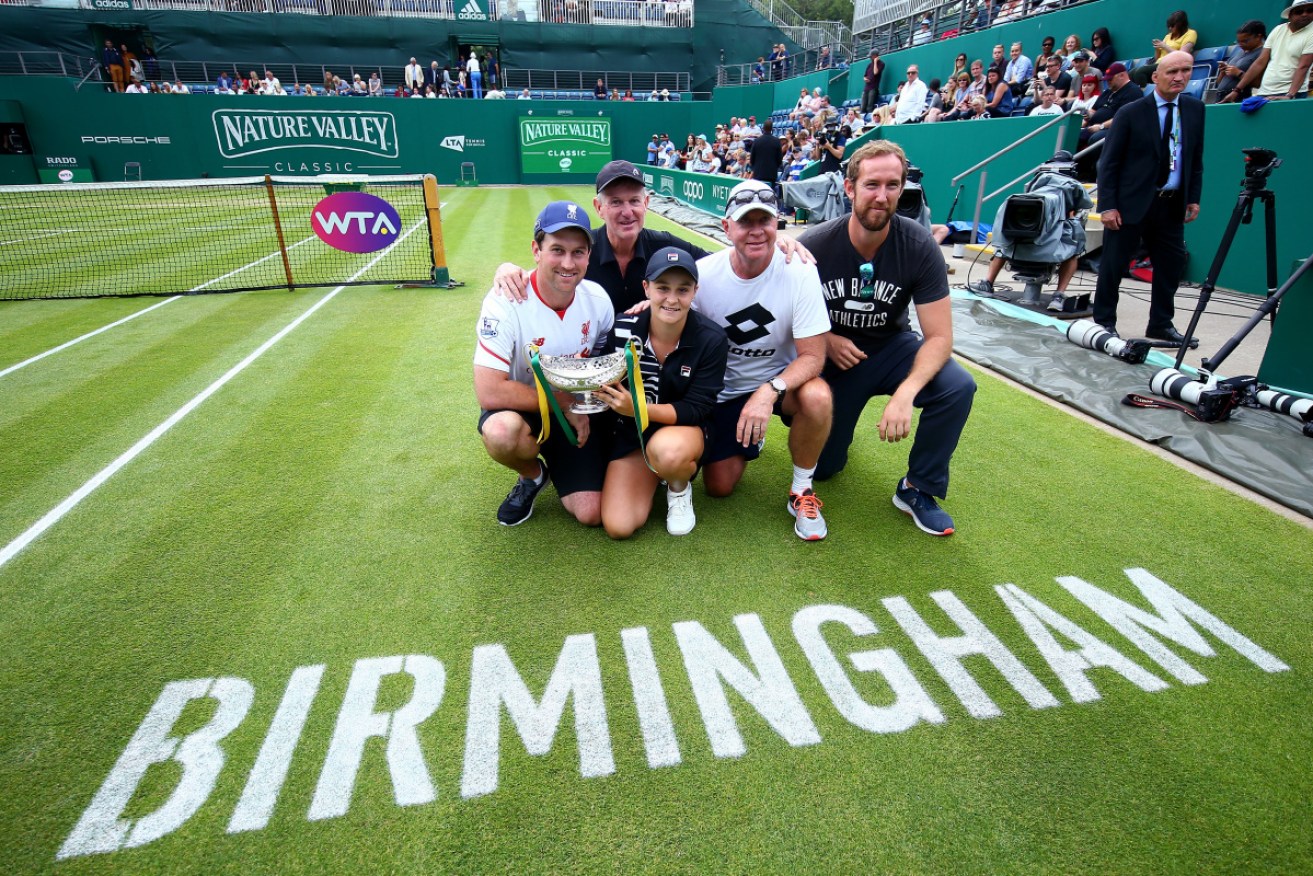 Team Barty: Ash Barty with her coach Craig Tyzzer (rear) after winning at Birmingham. 