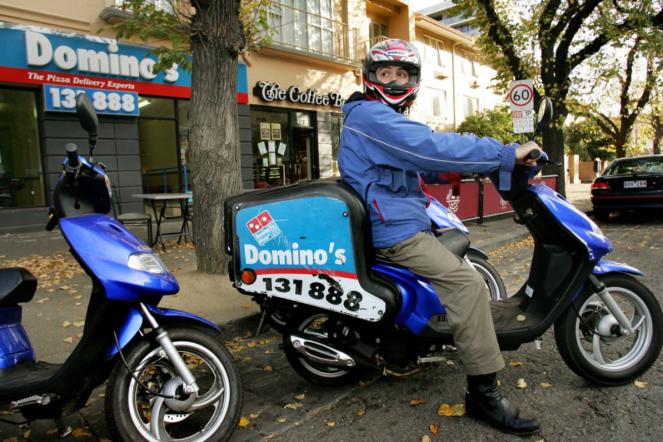 Domino's is accused of systemically underpaying its workers.