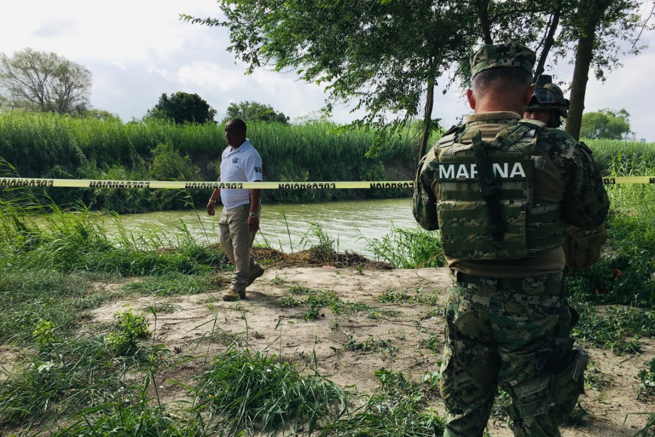 Mexican authorities on their side of the Rio Grande near where the two bodies were found.
