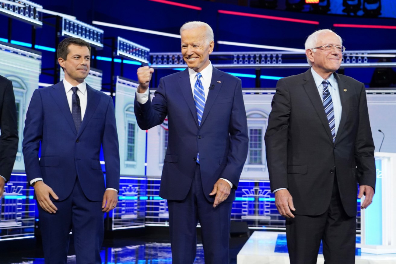 Democratic presidential candidates Joe Biden (centre) and Bernie Sanders at the first Democratic presidential debate on in Florida. 