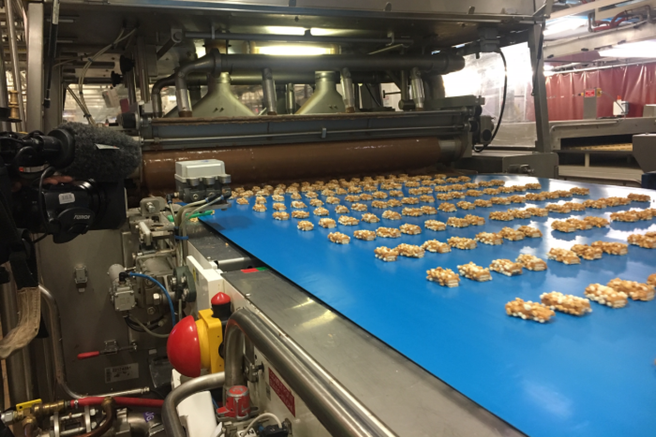 Picnic bars getting coated in chocolate at the Mondelez factory in Melbourne.