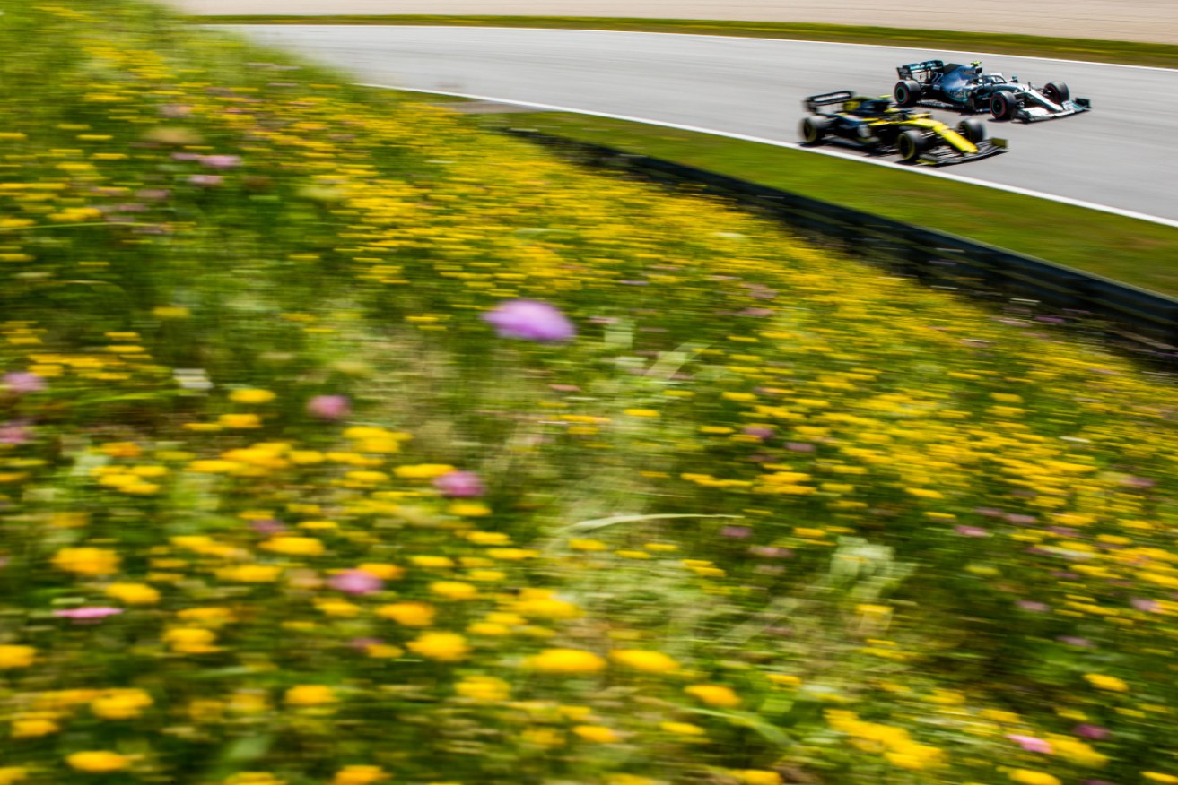 Daniel Ricciardo's Renault is passed by Valtteri Bottas' Mercedes at the Austrian Grand Prix. 