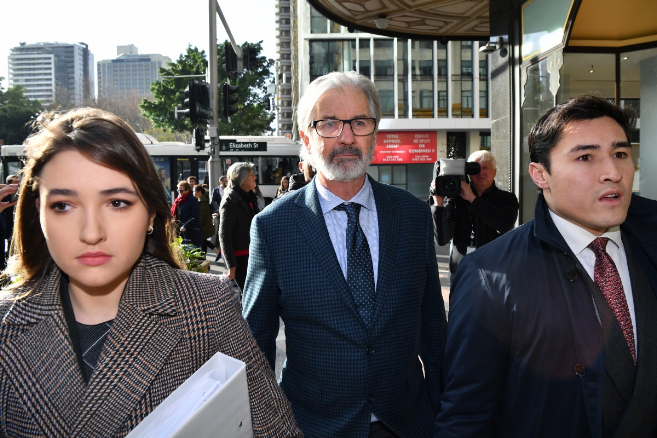John Jarratt arrives at Sydney's Downing Centre Local Court for the first day of his rape trial on Monday.