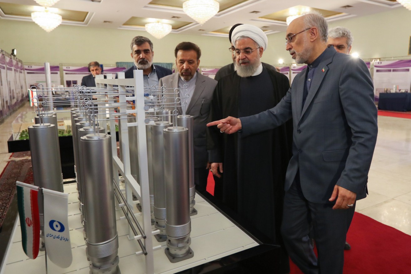 Iran's President Hassan Rouhani inspecting nuclear technology with the head of Iran's nuclear technology organisation Ali Akbar Salehi.