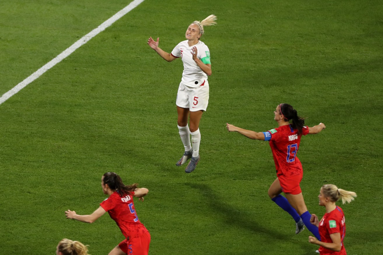 Steph Houghton of England reacts after missing an opportunity to equalise from the penalty spot against the USA. 