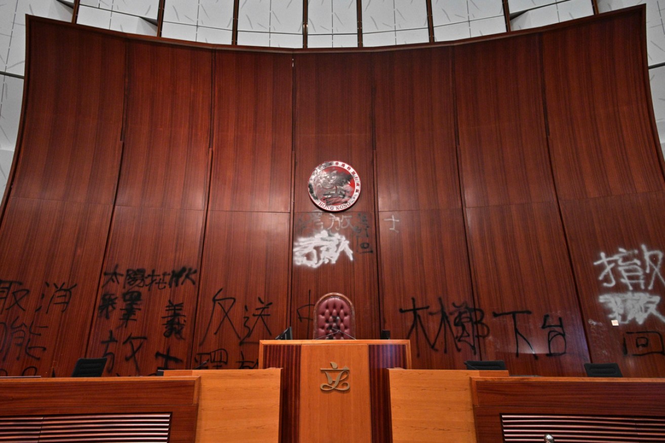 Graffiti is seen behind the speakers chair in the main chamber of the Hong Kong Legislative Council.